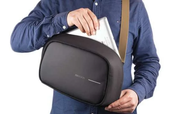 XD Design Bobby Sling Crossbody Bag, Black crossbody sling bag worn with tablet prop